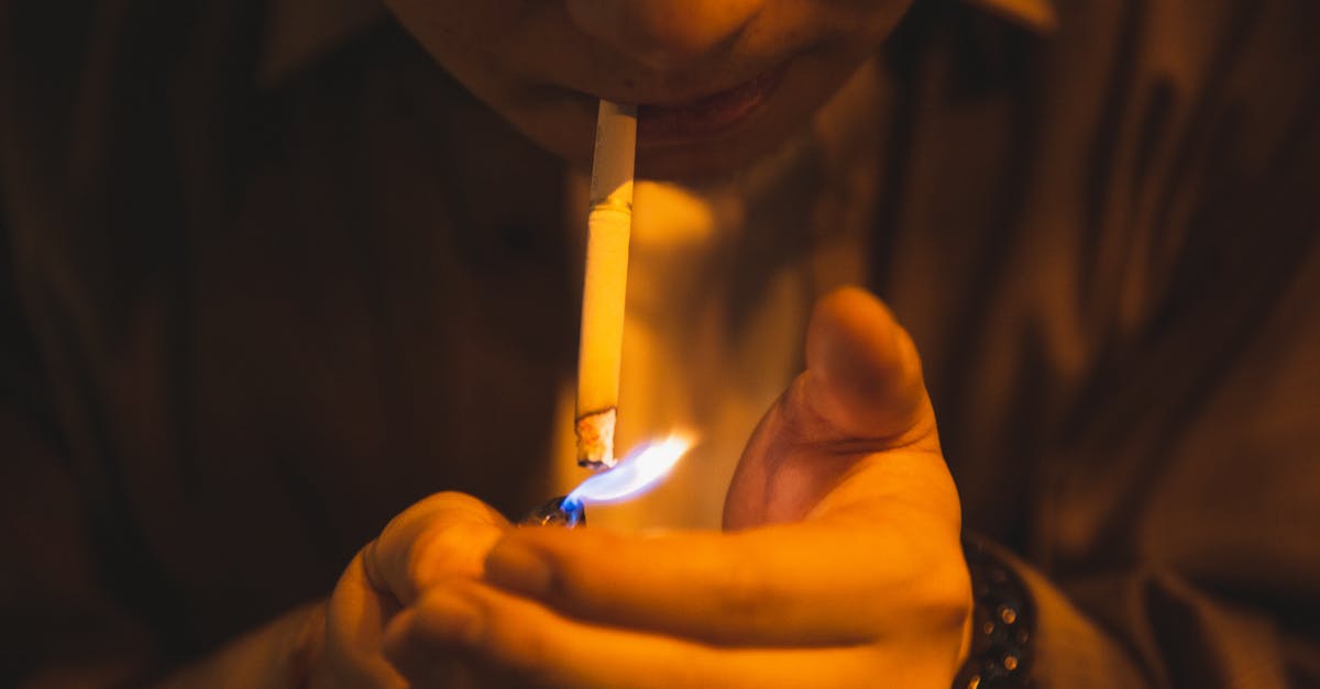 Can a few bad (dead) mussels harm a larger batch? - Crop male with burning lighter and cigarette smoking for reducing stress in light of lamp Can a few bad (dead) mussels harm a larger batch? - Crop male with burning lighter and cigarette smoking for reducing stress in light of lamp