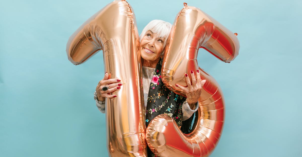 Can a large number of eggs be scrambled in a pot? - A Happy Elderly Woman Celebrating Her Birthday while Holding a Huge Balloon Numbers Can a large number of eggs be scrambled in a pot? - A Happy Elderly Woman Celebrating Her Birthday while Holding a Huge Balloon Numbers