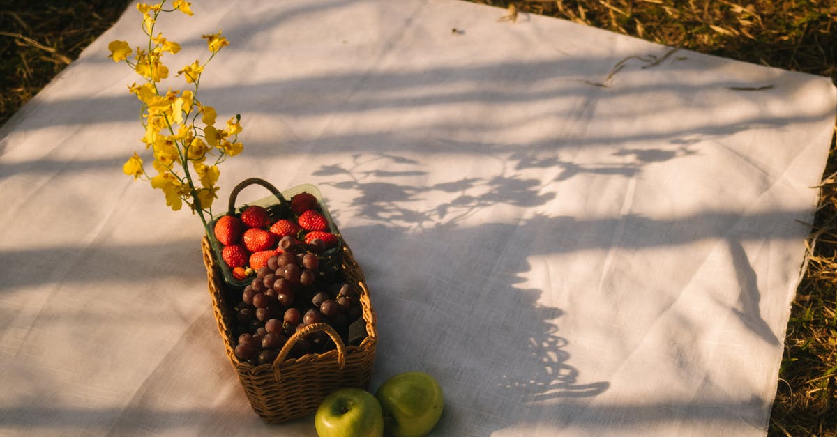 Can anything be done with cooking apples that fall early? - Basket of Fruit on White Cloth Can anything be done with cooking apples that fall early? - Basket of Fruit on White Cloth