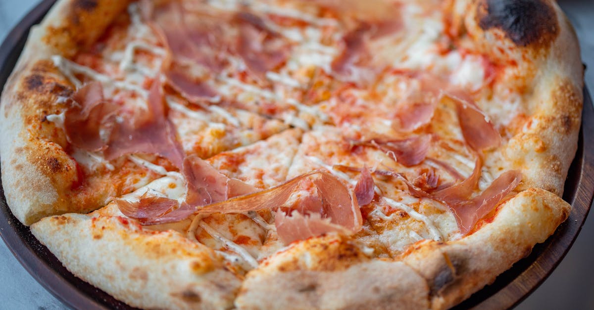 Can baked savory pastries with ham or bacon be left at room temperature? [duplicate] - Classic Pizza Baked and Cut in Triangular Servings