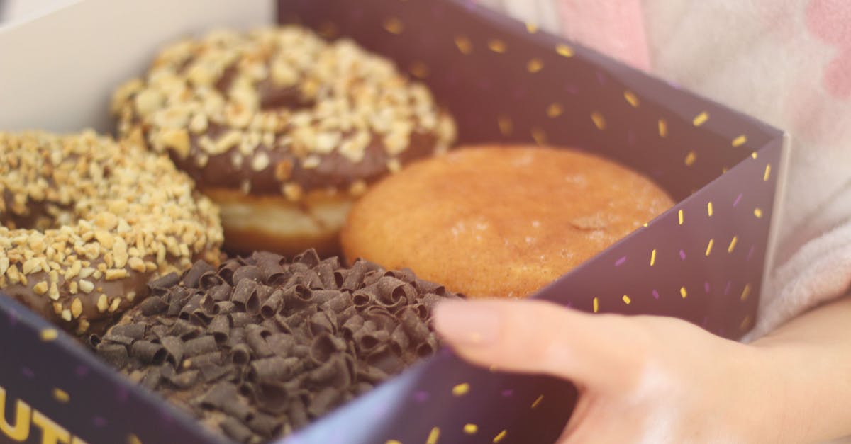 Can couverture chocolate be substituted with other ingredients? - Person Holding Box of Donuts Can couverture chocolate be substituted with other ingredients? - Person Holding Box of Donuts