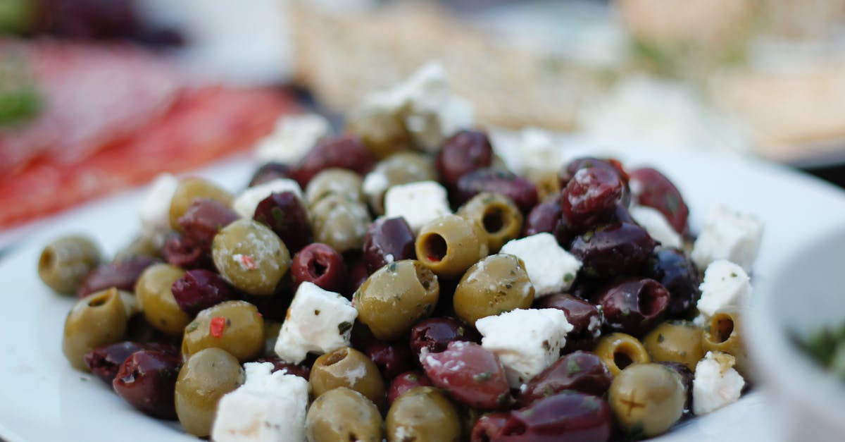 Can crumbled feta cheese last almost a year? - Purple and Green Olives with Cheese on Plate Can crumbled feta cheese last almost a year? - Purple and Green Olives with Cheese on Plate