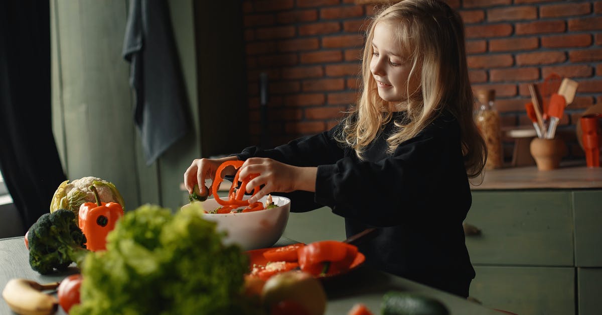 Can I add body to vegan stock with carrageenan? - Adorable smiling child adding sliced pepper in salad bowl standing near table with assorted vegetables and fruits during vegetarian meal preparation Can I add body to vegan stock with carrageenan? - Adorable smiling child adding sliced pepper in salad bowl standing near table with assorted vegetables and fruits during vegetarian meal preparation