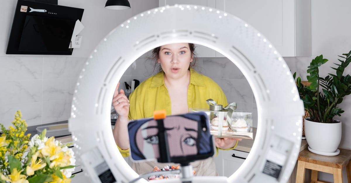 Can I broil a box cake in the oven? - Young woman recording new vlog on smartphone in kitchen Can I broil a box cake in the oven? - Young woman recording new vlog on smartphone in kitchen