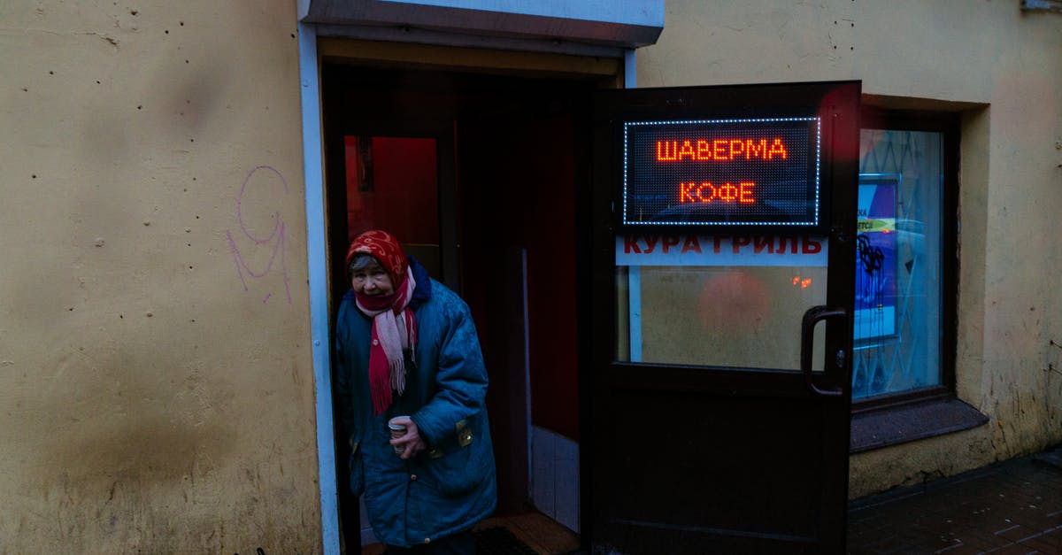 Can I continue to age store bought cheese? - Senior gloomy female in shawl and warm jacket with cup of coffee leaning on entrance of bistro and looking at camera Can I continue to age store bought cheese? - Senior gloomy female in shawl and warm jacket with cup of coffee leaning on entrance of bistro and looking at camera
