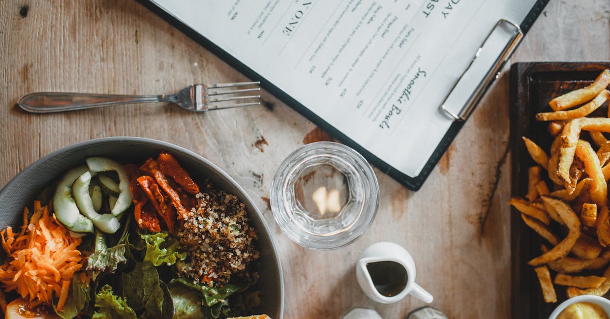 Can I cook my haggis from frozen? - Salad bowl and french fries served on table in cafe Can I cook my haggis from frozen? - Salad bowl and french fries served on table in cafe