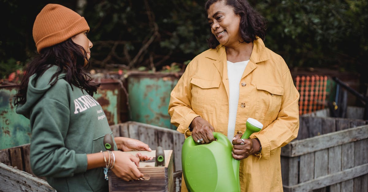 Can I increase the cocoa content in fudge? - Smiling ethnic farmers with gardening instruments speaking in countryside Can I increase the cocoa content in fudge? - Smiling ethnic farmers with gardening instruments speaking in countryside