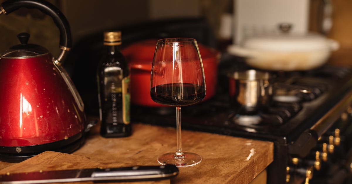Can I keep mulled wine on the stove for longer - Wineglass placed on table near stone in kitchen Can I keep mulled wine on the stove for longer - Wineglass placed on table near stone in kitchen