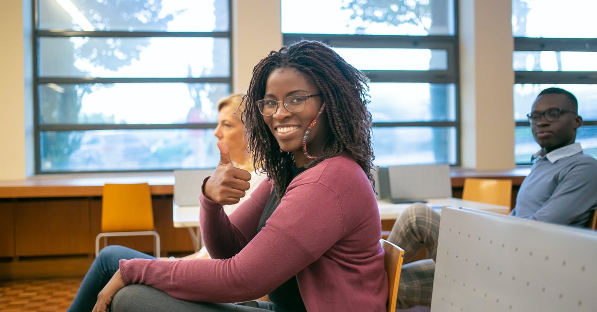Can I learn to like wine? - Black woman showing thumb up to camera Can I learn to like wine? - Black woman showing thumb up to camera