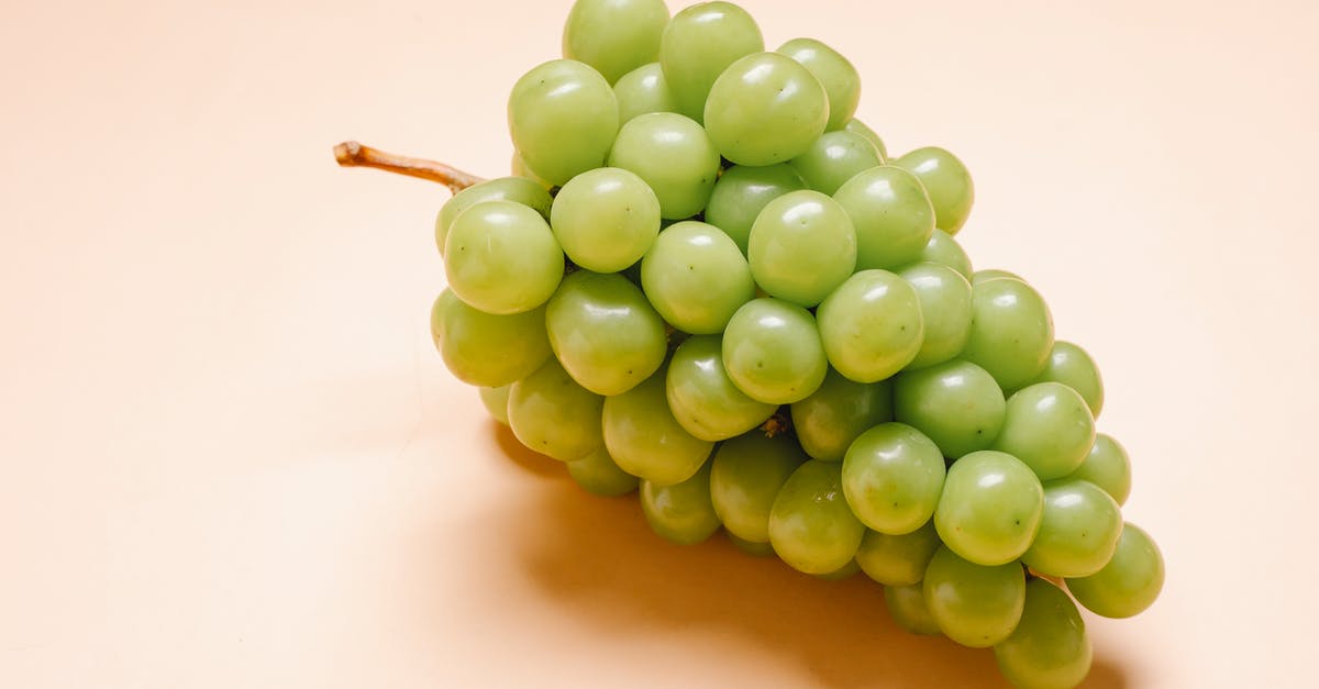 Can I make grapes honey from grape juice only - Fresh ripe green grapes on beige background Can I make grapes honey from grape juice only - Fresh ripe green grapes on beige background
