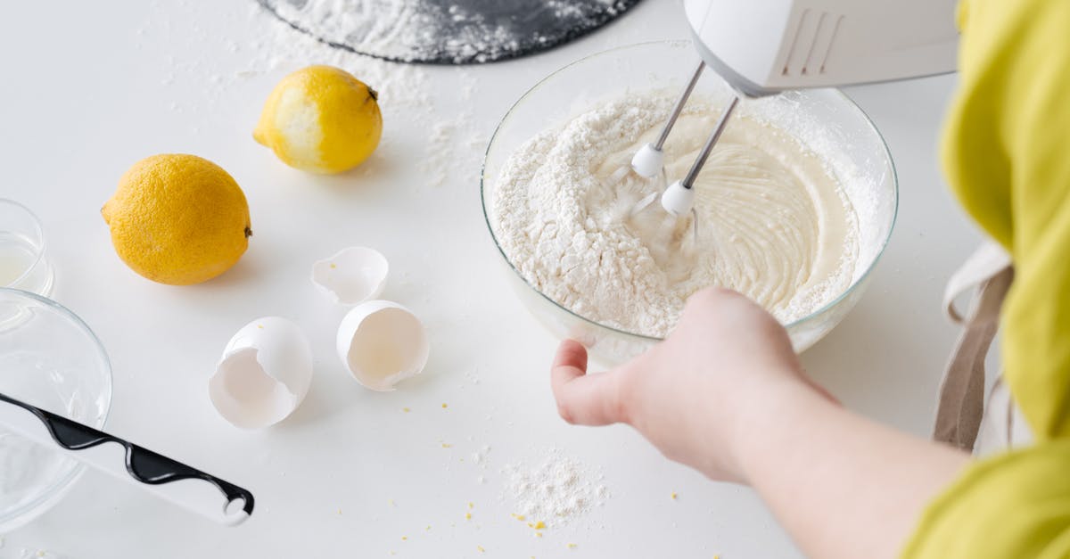 Can I make lemon curd more sour/tart after it's cooked? - From above of crop anonymous female with mixer preparing cake dough at table with fresh lemons and eggshells in house Can I make lemon curd more sour/tart after it's cooked? - From above of crop anonymous female with mixer preparing cake dough at table with fresh lemons and eggshells in house