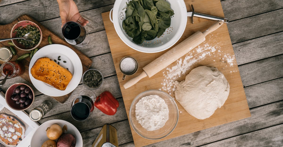 Can I make my dough for dinner rolls ahead in bread maker and refrigerate overnight? [duplicate] - Person Slicing Vegetable on Chopping Board