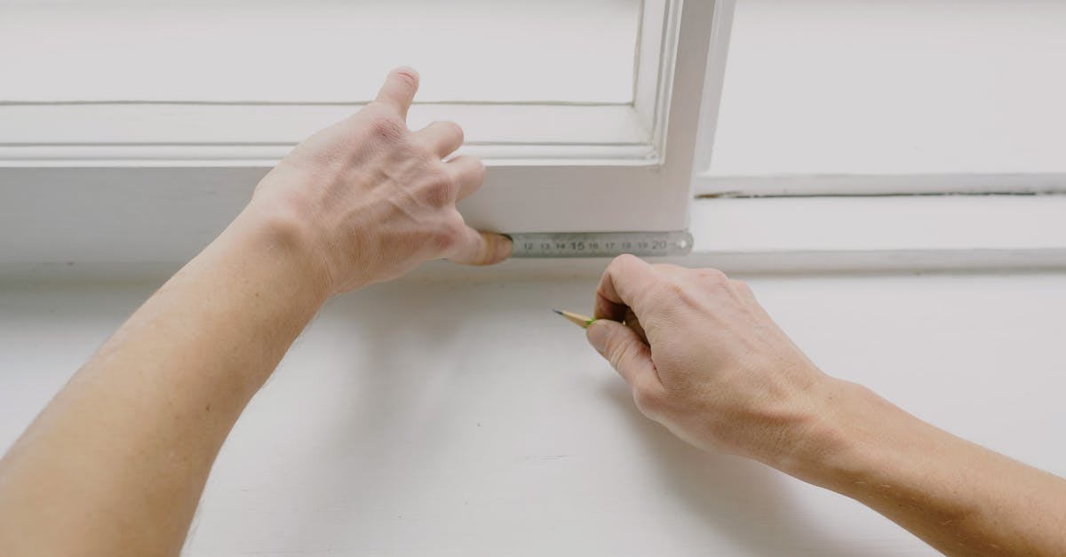 Can I measure solids-not-fat using nutrition facts only? - From above of crop unrecognizable male worker measuring window frame with metal ruler and pencil in house