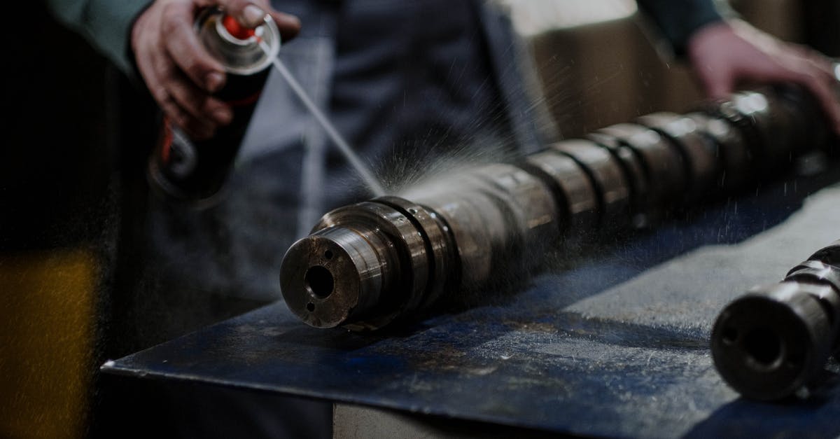 Can I repair a cake tin which has started to leak? - Person Spraying Degreaser on the Camshaft Can I repair a cake tin which has started to leak? - Person Spraying Degreaser on the Camshaft