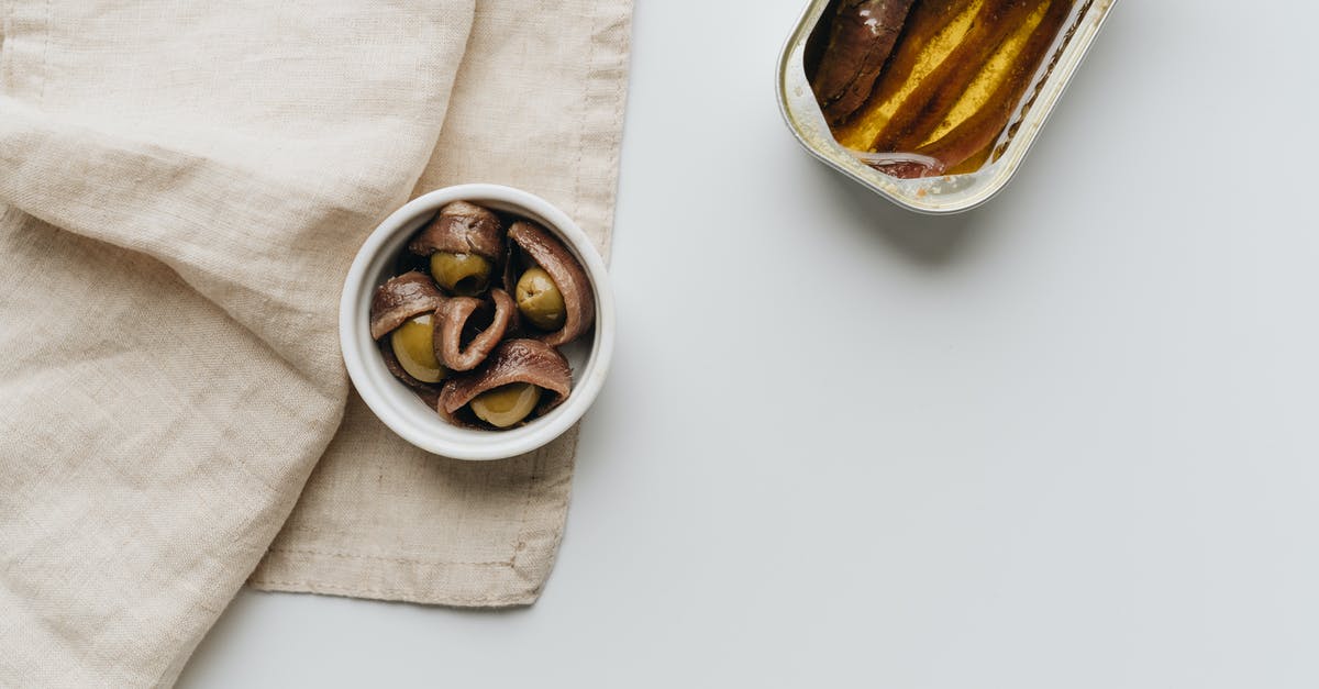 Can I substitute mascarpone for ricotta? - Close-Up Shot of a Can of Anchovies beside Olives Can I substitute mascarpone for ricotta? - Close-Up Shot of a Can of Anchovies beside Olives