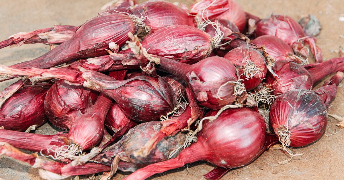 Can I thaw whole Ginger root to use later? - Pile of fresh shallots on dry terrain on street Can I thaw whole Ginger root to use later? - Pile of fresh shallots on dry terrain on street