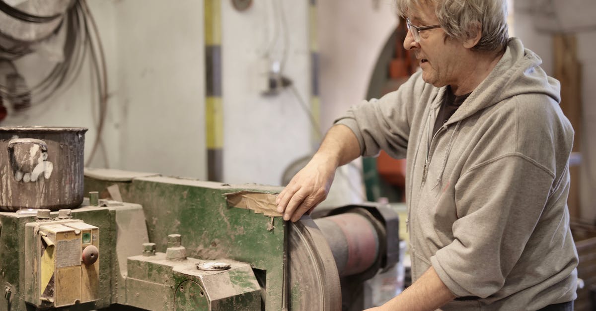 Can I use a crêpe pan instead of a comal? - Senior man working with metal details in workshop Can I use a crêpe pan instead of a comal? - Senior man working with metal details in workshop