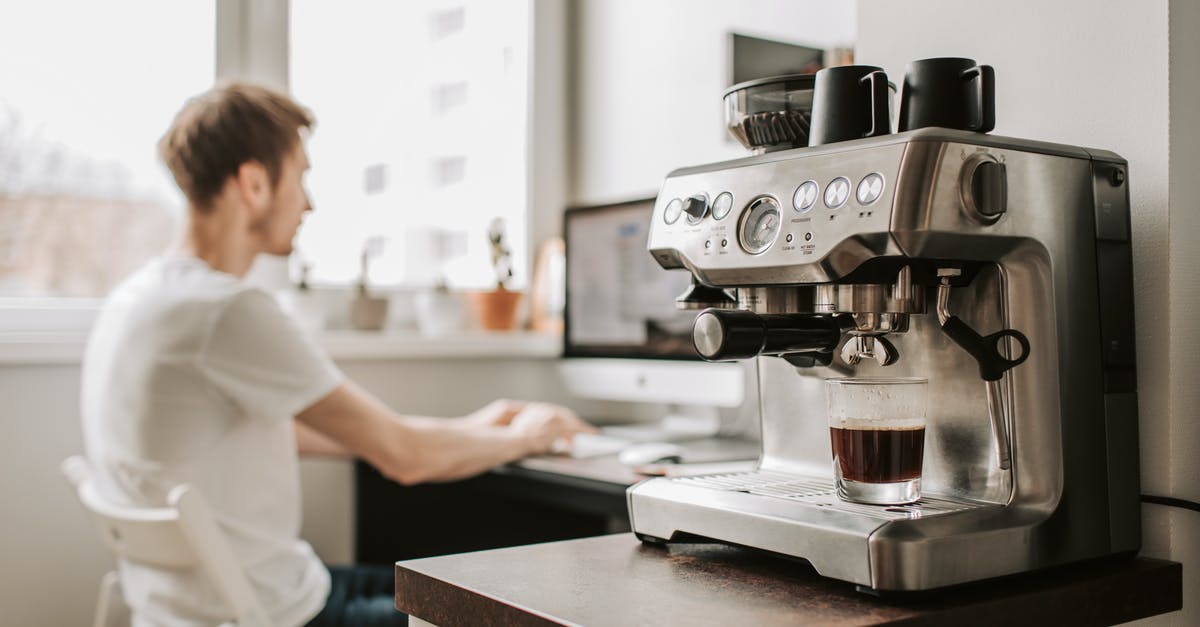 Can I use a plastic cup instead of a ramekin for my panna cotta? - Male freelancer work on desktop computer near coffee machine