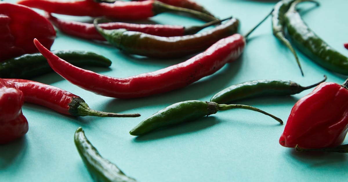 Can I use a whole uncut green pepper that I accidentally froze or is it garbage? - Heap of fresh green and red chili peppers Can I use a whole uncut green pepper that I accidentally froze or is it garbage? - Heap of fresh green and red chili peppers