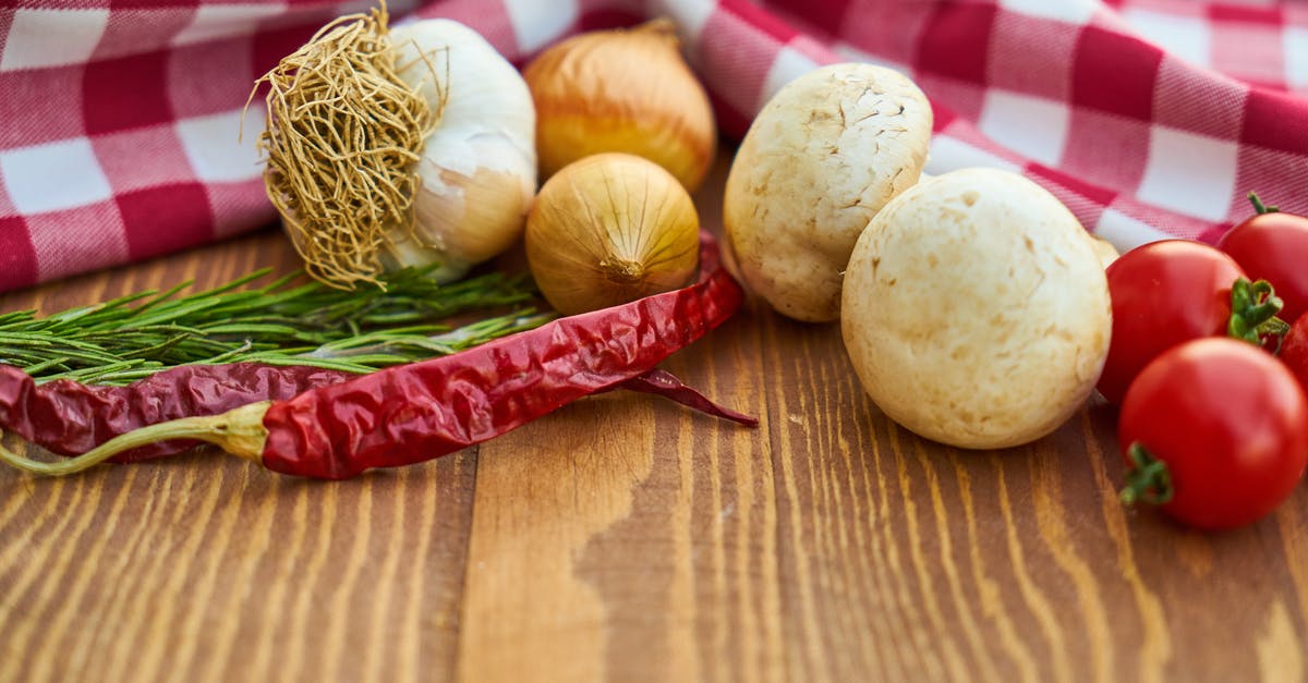 Can I use garlic leaf for cooking? - Onions, Garlic and Tomatoes Close-up Photo Can I use garlic leaf for cooking? - Onions, Garlic and Tomatoes Close-up Photo