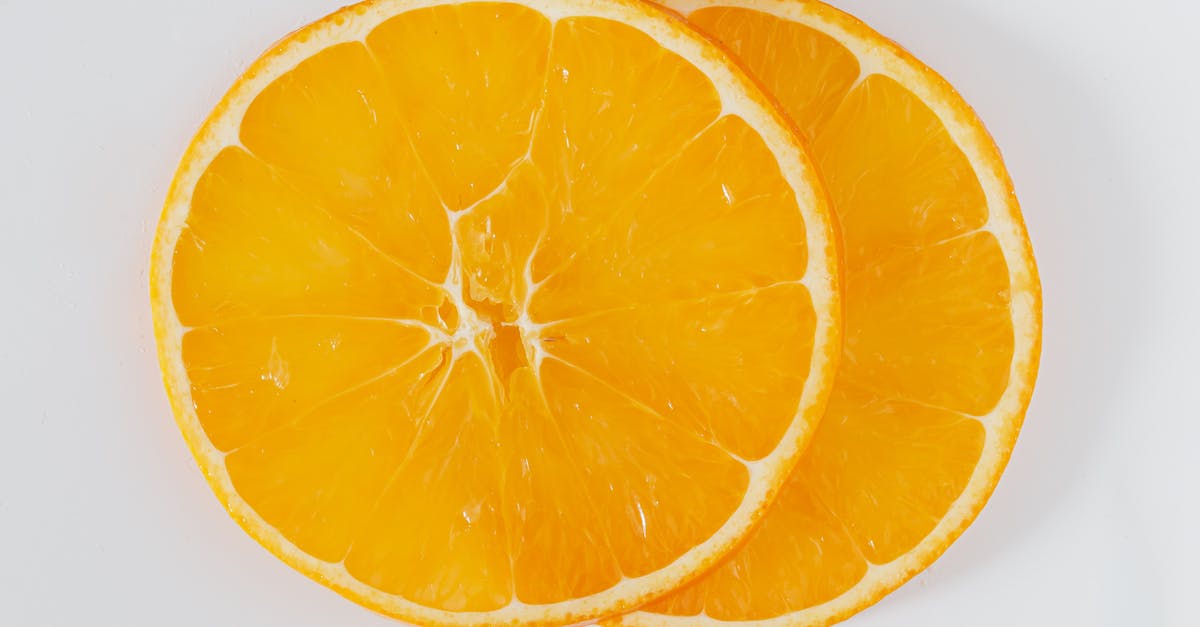 Can I use orange juice to pasteurize egg whites? - Top view closeup of cut round slices of fresh orange on white background Can I use orange juice to pasteurize egg whites? - Top view closeup of cut round slices of fresh orange on white background