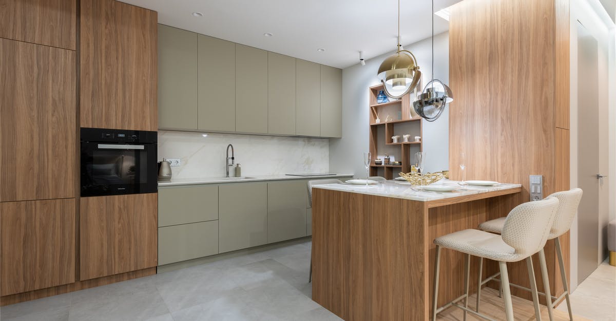 Can I use this Ikea glassware on stove top? - Interior of bright modern kitchen with cupboards near chairs with counter decorated with glasses and plates under lamps next to shelves on wall Can I use this Ikea glassware on stove top? - Interior of bright modern kitchen with cupboards near chairs with counter decorated with glasses and plates under lamps next to shelves on wall