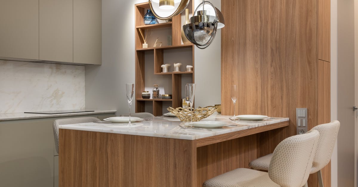 Can I use this Ikea glassware on stove top? - Interior of bright modern kitchen with cupboards near chairs with counter decorated with plates and glasses under lamps next to shelves Can I use this Ikea glassware on stove top? - Interior of bright modern kitchen with cupboards near chairs with counter decorated with plates and glasses under lamps next to shelves