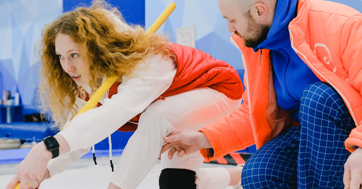 can ice help with spicy food? - Man trainer fixing leg position of woman player in curling can ice help with spicy food? - Man trainer fixing leg position of woman player in curling