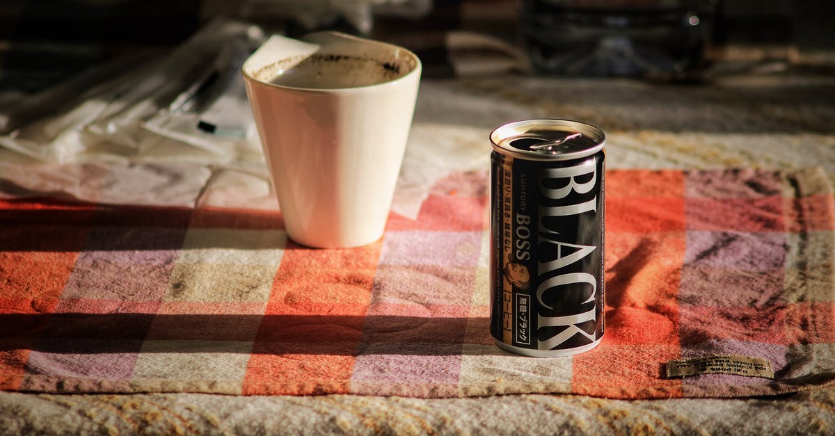 Can nonstick pans go in the oven? - Black Boss Can on Top Beside White Mug Can nonstick pans go in the oven? - Black Boss Can on Top Beside White Mug