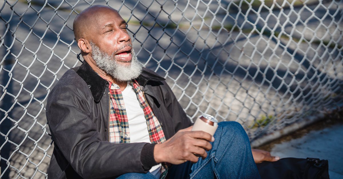 Can old eggs affect my Creme Brulee? - African American senior man with closed eyes and opened mouth sitting near metal fence and holding beer can Can old eggs affect my Creme Brulee? - African American senior man with closed eyes and opened mouth sitting near metal fence and holding beer can
