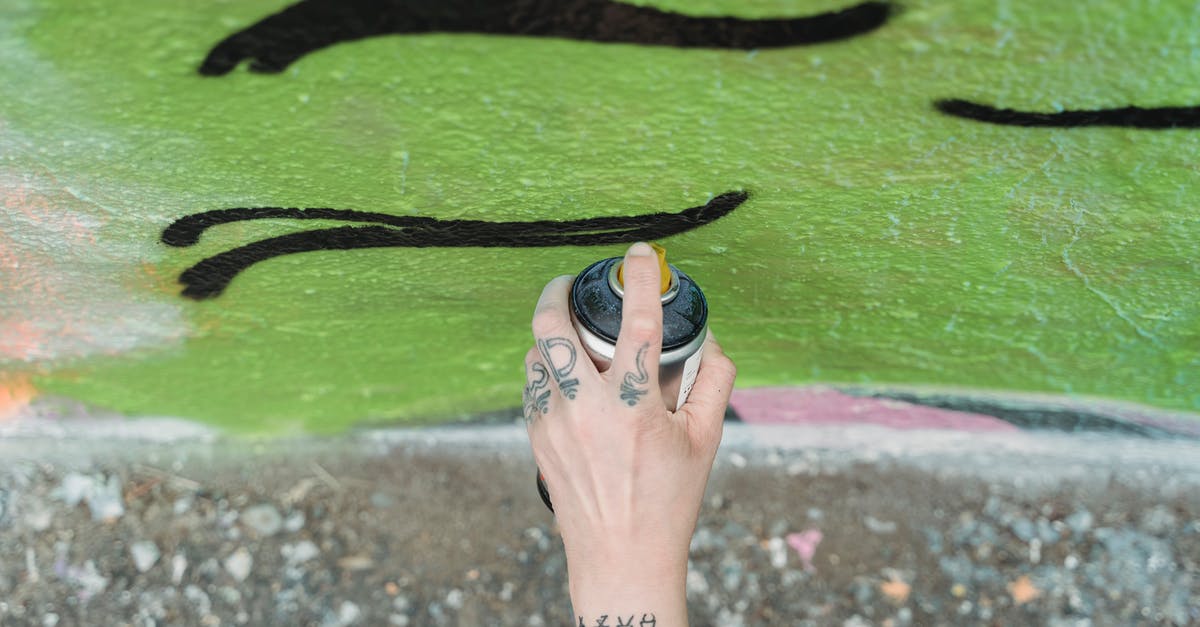 Can one tell from the outside whether a papaya has seeds? - Unrecognizable artist painting graffiti on wall Can one tell from the outside whether a papaya has seeds? - Unrecognizable artist painting graffiti on wall