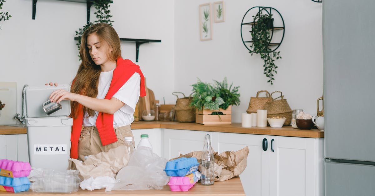 Can over whipped egg whites be used in other ways? - Young responsible female standing in kitchen and putting tin can into bucket while sorting trash Can over whipped egg whites be used in other ways? - Young responsible female standing in kitchen and putting tin can into bucket while sorting trash