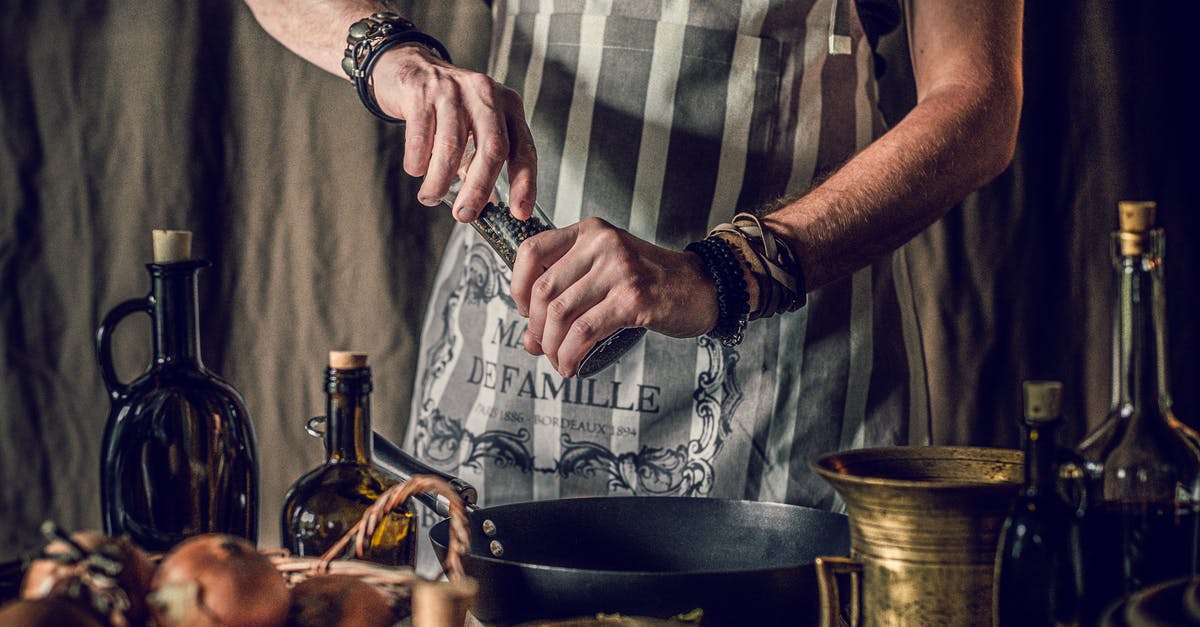 Can pickled pepper oil be used as cooking oil? - Crop cook using pepper mill while preparing healthy food in kitchen Can pickled pepper oil be used as cooking oil? - Crop cook using pepper mill while preparing healthy food in kitchen