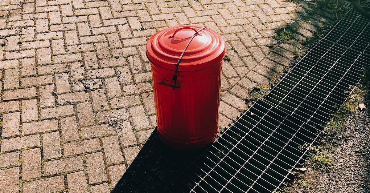 Can red lentils be used for mujadara? - High angle of red metal trash can placed on pavement near sewer grates in city street in sunny summer day Can red lentils be used for mujadara? - High angle of red metal trash can placed on pavement near sewer grates in city street in sunny summer day