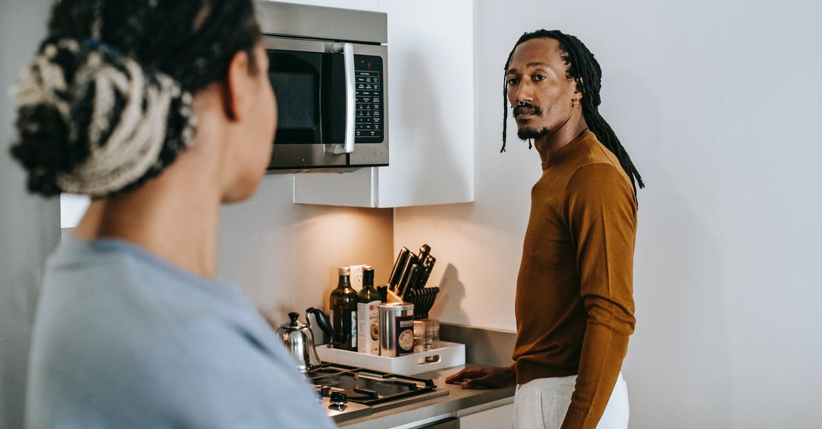 Can the broiler replicate a regular gas oven? - Anonymous ethnic female speaking with boyfriend with dreadlocks while looking at each other in house Can the broiler replicate a regular gas oven? - Anonymous ethnic female speaking with boyfriend with dreadlocks while looking at each other in house