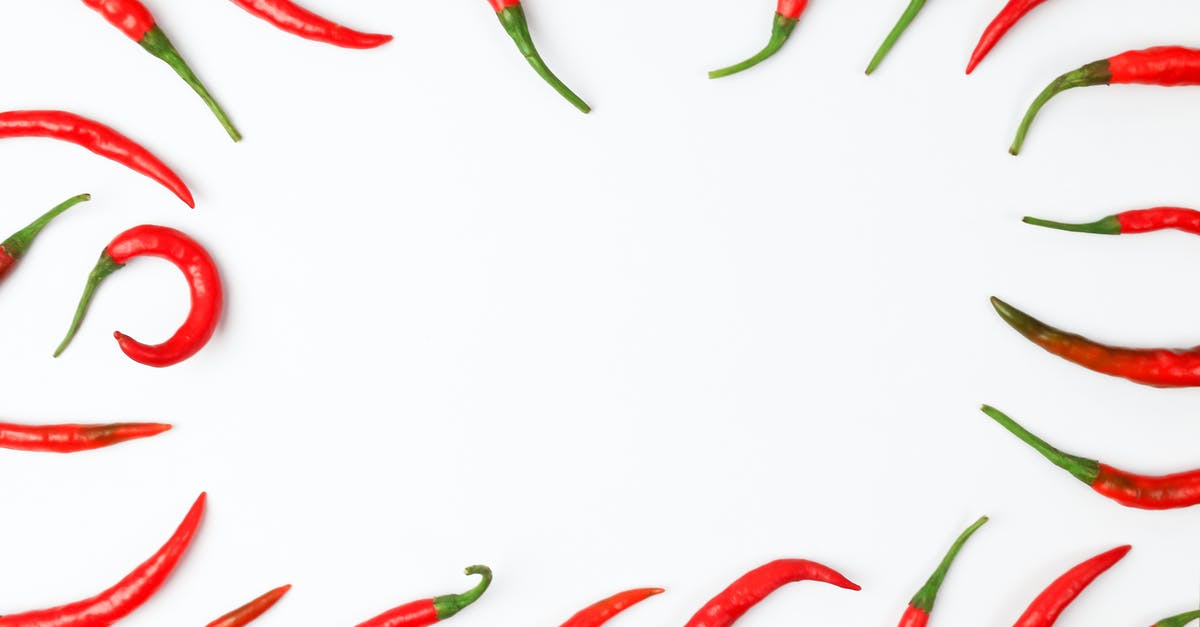 Can whole chilli peppers be frozen? - Close-Up Photo of Chili Peppers on a White Surface Can whole chilli peppers be frozen? - Close-Up Photo of Chili Peppers on a White Surface