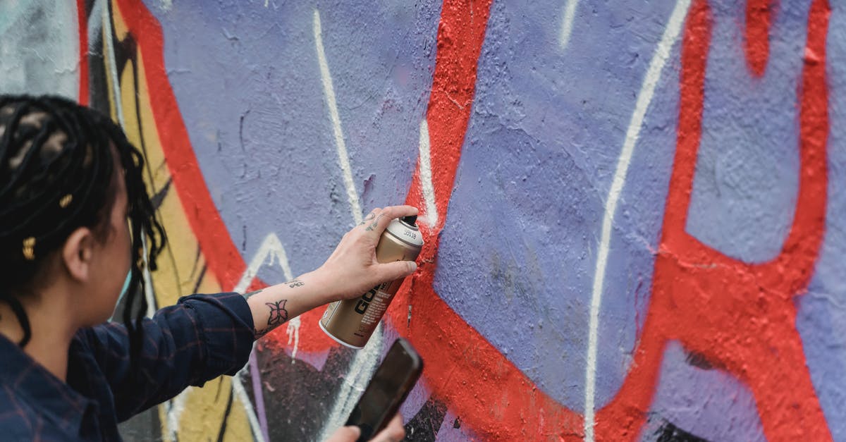 Can you create brown butter directly from heavy cream? - From above side view of crop faceless female artist with braided hair painting graffiti on wall while standing on street Can you create brown butter directly from heavy cream? - From above side view of crop faceless female artist with braided hair painting graffiti on wall while standing on street