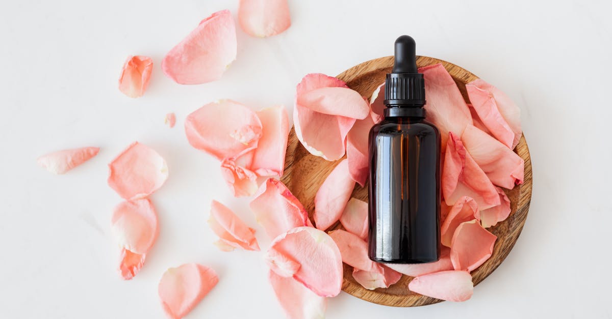 Can you cure fish in jar? - Top view of empty brown bottle for skin care product placed on wooden plate with fresh pink rose petals on white background isolated Can you cure fish in jar? - Top view of empty brown bottle for skin care product placed on wooden plate with fresh pink rose petals on white background isolated