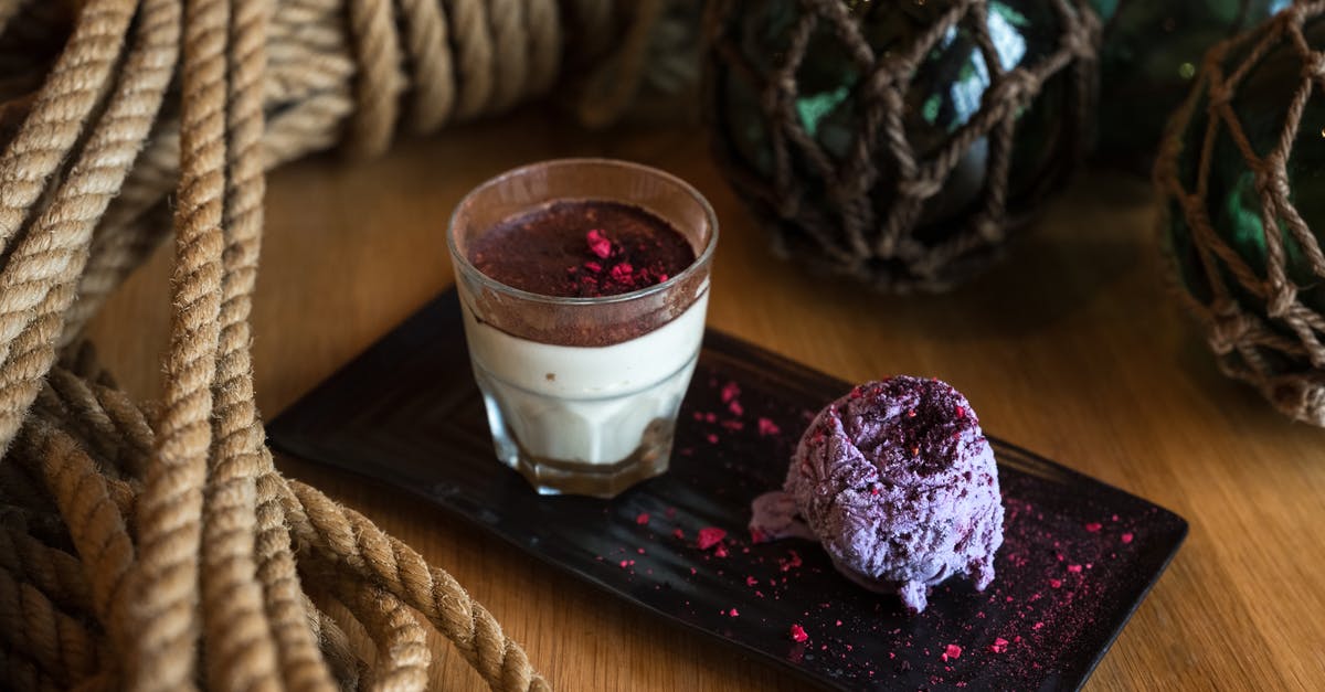 Can you freeze food with cream in it? - From above of glass of appetizing cream dessert with chocolate top served with blueberry ice cream garnished with pink dye on ceramic plate surrounded by rope tied in knot and dark green glass balls in grid Can you freeze food with cream in it? - From above of glass of appetizing cream dessert with chocolate top served with blueberry ice cream garnished with pink dye on ceramic plate surrounded by rope tied in knot and dark green glass balls in grid