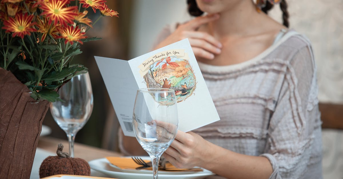 Can you make pan gravy if the turkey was brined? - Woman in Gray Scoop Neck Shirt Sitting Beside Table With Wine Glass and Silver Fork Can you make pan gravy if the turkey was brined? - Woman in Gray Scoop Neck Shirt Sitting Beside Table With Wine Glass and Silver Fork