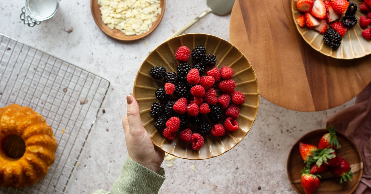 Can you make strawberry extract at home? - Person Holding Bowl of Strawberries Can you make strawberry extract at home? - Person Holding Bowl of Strawberries