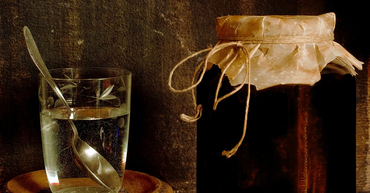 Can you water bath a cooked then cooled jam recipe? - Jar with homemade jam placed with glass of water on shabby table in rural house Can you water bath a cooked then cooled jam recipe? - Jar with homemade jam placed with glass of water on shabby table in rural house