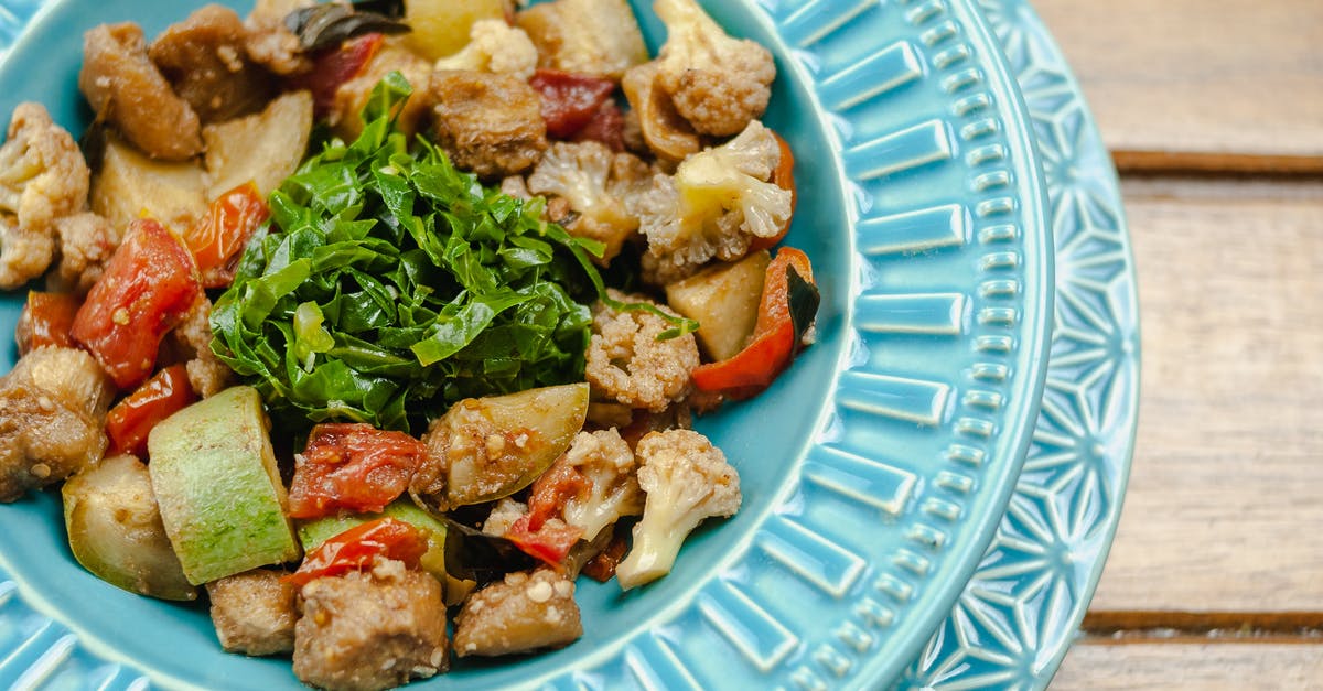 Can zucchini be increased in zucchini bread recipes? - Tasty warm vegetable salad served in blue plate Can zucchini be increased in zucchini bread recipes? - Tasty warm vegetable salad served in blue plate