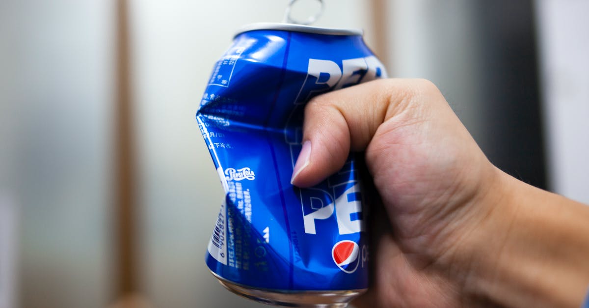Canned cubed tomatoes vs crushed - A Person Crushing a Can of Soda Canned cubed tomatoes vs crushed - A Person Crushing a Can of Soda