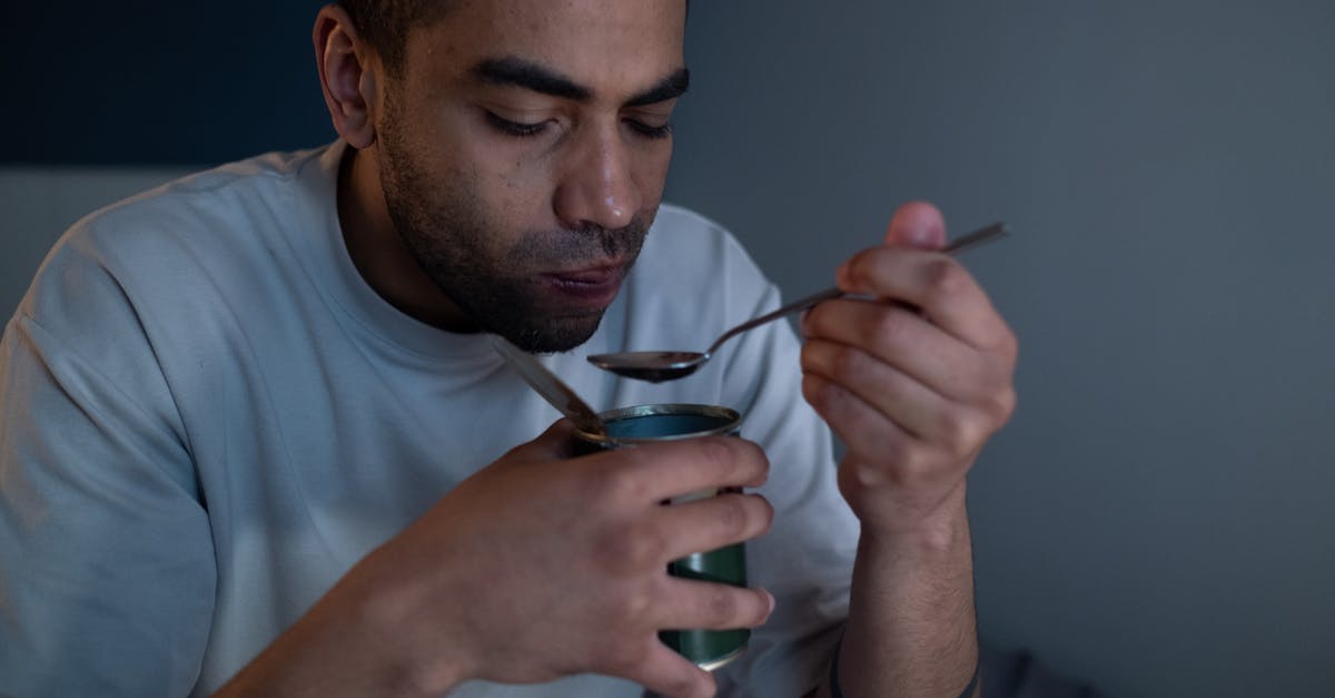 Canned (shelf stable) pickled eggs that don't require refrigeration? - Man Wearing White Shirt Eating Canned Food Canned (shelf stable) pickled eggs that don't require refrigeration? - Man Wearing White Shirt Eating Canned Food