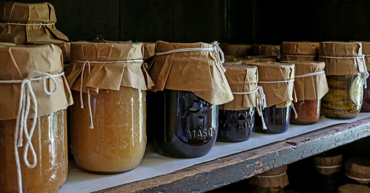 Canning Jar bottom pops off during canning - Brown Glass Jars on White Wooden Shelf Canning Jar bottom pops off during canning - Brown Glass Jars on White Wooden Shelf