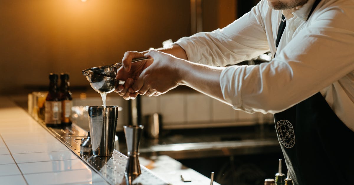Carbonated drinks in cocktail shakers? - Man in White Long Sleeve Shirt Holding Clear Glass Cup Carbonated drinks in cocktail shakers? - Man in White Long Sleeve Shirt Holding Clear Glass Cup
