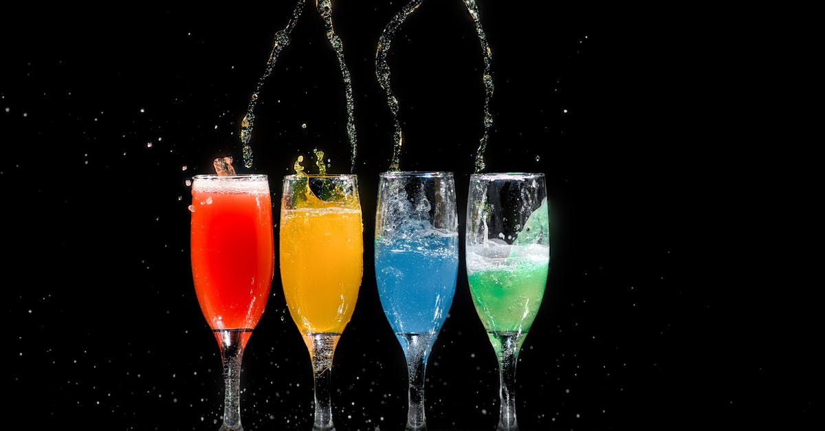 Carbonated drinks in cocktail shakers? - Four Champagne Flutes With Assorted-color Liquids Carbonated drinks in cocktail shakers? - Four Champagne Flutes With Assorted-color Liquids