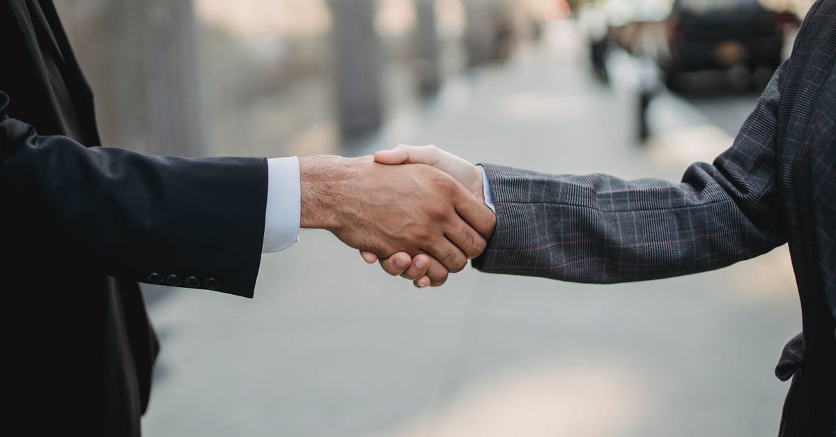 Carbonation diffuser versus shaking - Close-up of Business People Shaking Hands Carbonation diffuser versus shaking - Close-up of Business People Shaking Hands
