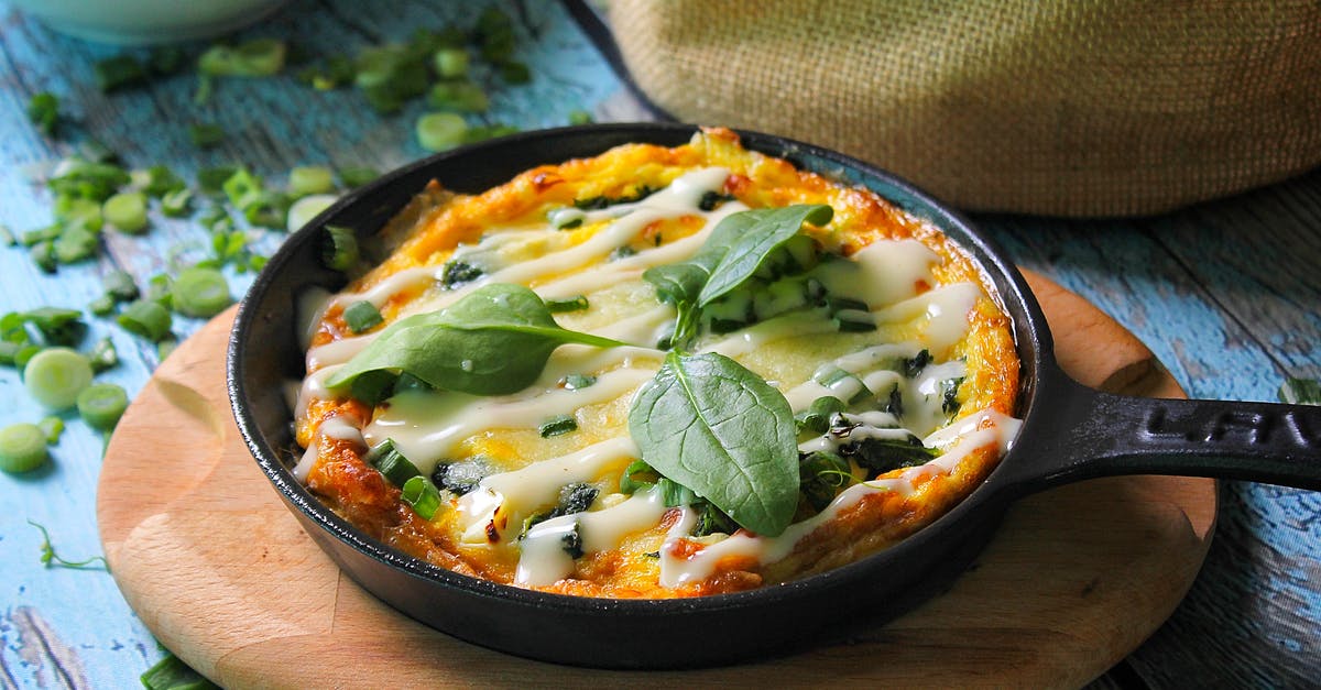 cast iron skillet - A Baked Casserole on a Cast Iron Skillet cast iron skillet - A Baked Casserole on a Cast Iron Skillet
